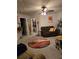 Inviting living room featuring a ceiling fan, comfortable seating, and a decorative rug at 7848 Rock Rose Ln, Fairburn, GA 30213