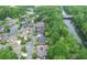 Stunning aerial view of a community with lush landscaping, water features, and well-maintained homes at 9175 Etching Overlook, Johns Creek, GA 30097