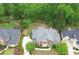Beautiful home in a lush, green neighborhood with mature trees and well-maintained lawns at 9175 Etching Overlook, Johns Creek, GA 30097