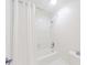 Clean bathroom featuring a shower and tub combination with a bright white shower curtain at 9175 Etching Overlook, Johns Creek, GA 30097