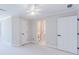 Large bedroom offers access to bathroom with custom wallpaper and an expansive view at 9175 Etching Overlook, Johns Creek, GA 30097