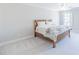 Bedroom featuring neutral walls, carpeted floors, and a bed with floral accents at 9175 Etching Overlook, Johns Creek, GA 30097