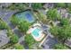 Aerial view of the community pool, tennis courts, and meticulously maintained landscaping at 9175 Etching Overlook, Johns Creek, GA 30097