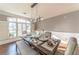 Bright dining room features hardwood floors, modern lighting, and a large window with shutters at 9175 Etching Overlook, Johns Creek, GA 30097