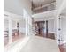 Open foyer showcases hardwood and tile floors, with views into the dining room and living room at 9175 Etching Overlook, Johns Creek, GA 30097