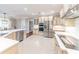 Bright eat-in kitchen featuring stainless steel appliances and large countertops, ideal for cooking and entertaining at 9175 Etching Overlook, Johns Creek, GA 30097