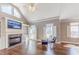 Cozy living room featuring a fireplace, built-in shelves and vaulted ceilings at 9175 Etching Overlook, Johns Creek, GA 30097