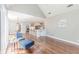 Open-concept living area with vaulted ceiling flows into kitchen, creating a spacious and airy atmosphere at 9175 Etching Overlook, Johns Creek, GA 30097