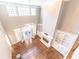 Living room with high ceilings, built-in shelving, fireplace and French doors to an outdoor patio at 9175 Etching Overlook, Johns Creek, GA 30097