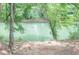 Enjoy the tranquil river view from the backyard, complete with seating and passing kayakers at 9175 Etching Overlook, Johns Creek, GA 30097