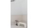 Minimalist room with a decorative table and a small upholstered bench at 9175 Etching Overlook, Johns Creek, GA 30097
