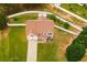 Aerial view of the home showing the large lot with mature trees and landscaping at 13347 Henderson Ct, Hampton, GA 30228