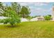 Large, well-maintained backyard with a privacy fence and an outdoor building at 13347 Henderson Ct, Hampton, GA 30228