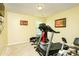 Basement gym area features equipment with carpeted flooring and natural light at 13347 Henderson Ct, Hampton, GA 30228
