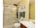 Tiled bathroom featuring a shower, a vanity, and a toilet at 13347 Henderson Ct, Hampton, GA 30228