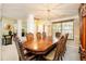 Formal dining room with ornate wood furniture and ample seating for large gatherings at 13347 Henderson Ct, Hampton, GA 30228