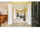 The entry features grand columns, marble floors, and views to the living and dining areas at 13347 Henderson Ct, Hampton, GA 30228