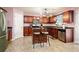 Cozy kitchen features warm lighting, an island, and stainless steel appliances at 13347 Henderson Ct, Hampton, GA 30228