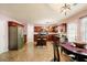 Well-lit kitchen with stainless steel appliances, an island, and tile flooring at 13347 Henderson Ct, Hampton, GA 30228