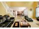 Bright and airy living room offering comfortable seating and a view to the kitchen at 13347 Henderson Ct, Hampton, GA 30228