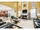 Spacious living room with a cozy fireplace, soaring ceilings, and plenty of natural light at 13347 Henderson Ct, Hampton, GA 30228