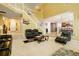 Spacious living room featuring a staircase, open layout, and plush seating at 13347 Henderson Ct, Hampton, GA 30228