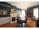 Charming dining room with a fireplace and a traditional dining set at 30 Sessions Nw St, Marietta, GA 30060