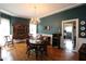 Spacious dining room featuring chandelier, hardwood floors, and built-in china cabinet at 30 Sessions Nw St, Marietta, GA 30060