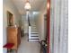 Inviting entryway with staircase, cabinet, vintage decor, and elegant design features at 30 Sessions Nw St, Marietta, GA 30060