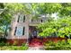 Gorgeous two-story home with mature trees, an inviting front porch, and a well-manicured lawn at 30 Sessions Nw St, Marietta, GA 30060