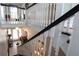 Bright foyer featuring white banisters and stairs, dark stair treads, and views to the entry and living room at 30 Sessions Nw St, Marietta, GA 30060