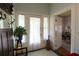 Traditional foyer featuring tile flooring, front door, and adjacent living space at 30 Sessions Nw St, Marietta, GA 30060
