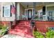 Welcoming front entrance with a red front door, stairs, and an inviting porch at 30 Sessions Nw St, Marietta, GA 30060