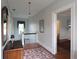 Bright hallway with hardwood floors and staircase leading to the upper level of the home at 30 Sessions Nw St, Marietta, GA 30060