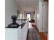 Upstairs hallway featuring a white banister and staircase, and views to the bedrooms at 30 Sessions Nw St, Marietta, GA 30060