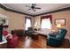 Comfortable living room featuring hardwood floors, traditional furnishings, large windows, and elegant decor at 30 Sessions Nw St, Marietta, GA 30060
