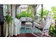 Relaxing porch featuring comfortable seating, a patterned rug, and decorative details at 30 Sessions Nw St, Marietta, GA 30060
