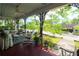 Inviting porch with a ceiling fan, stylish furniture and beautifully designed iron railings at 30 Sessions Nw St, Marietta, GA 30060