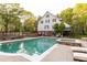 A beautiful backyard featuring a swimming pool, hot tub, and patio area with comfortable seating at 3380 Hill Forest Nw Trl, Acworth, GA 30101