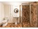 Elegant bathroom with tiled walk-in shower and stylish pedestal sink at 3380 Hill Forest Nw Trl, Acworth, GA 30101