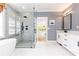 Bright bathroom features marble floors, a large glass shower, and white cabinets at 3380 Hill Forest Nw Trl, Acworth, GA 30101