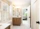 Bright bathroom featuring a vanity, window seat, and tiled floors at 3380 Hill Forest Nw Trl, Acworth, GA 30101