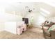 Spacious bonus room with skylights, seating area, and play kitchen for versatile use at 3380 Hill Forest Nw Trl, Acworth, GA 30101