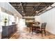 Charming dining area with exposed ceiling and view into the kitchen, perfect for casual meals at 3380 Hill Forest Nw Trl, Acworth, GA 30101