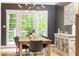 Dining room with natural light, hardwood floors, and modern chandelier at 3380 Hill Forest Nw Trl, Acworth, GA 30101