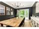 Dining room with hardwood floors, dark gray walls, and french doors at 3380 Hill Forest Nw Trl, Acworth, GA 30101