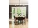 Dining room features a wooden table with seating for six and natural light at 3380 Hill Forest Nw Trl, Acworth, GA 30101