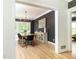 Inviting dining room boasts hardwood floors, stylish chandelier, and elegant buffet with views to backyard at 3380 Hill Forest Nw Trl, Acworth, GA 30101