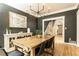 Bright dining room with hardwood floors, dark gray walls, and stairs nearby at 3380 Hill Forest Nw Trl, Acworth, GA 30101
