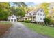 Charming exterior highlighting the lush greenery surrounding the house and garage at 3380 Hill Forest Nw Trl, Acworth, GA 30101
